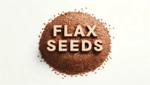 An image of flax seeds with the word FLAX SEEDS on top of the seeds.