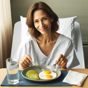 A woman in a hospital bed eats a ketogenic meal of eggs and avocado.