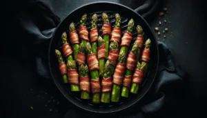 An image of bacon-wrapped asparagus in a cast iron frying pan.