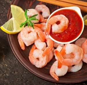 An image of prawns and cocktail sauce